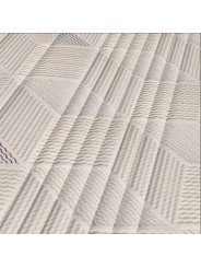 Detalle de la tapicería en Tejido Stretch Luxe con acolchado geométrico del colchón Versus Naturalia