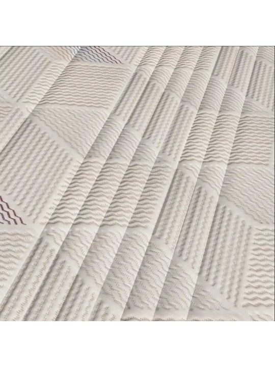 Detalle de la tapicería en Tejido Stretch Luxe con acolchado geométrico del colchón Versus Naturalia